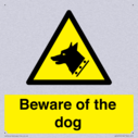beware-of-the-dog-with-dog-warning-symbol~